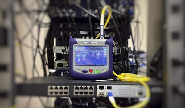 Modern optical fibre internet modem delivering high speed wireless internet to a home office in Canada.