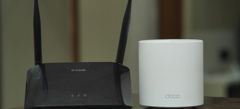 Technician mounting a WiFi access point in a business